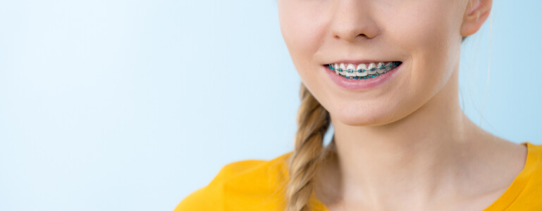 smiling teenage girl with braces